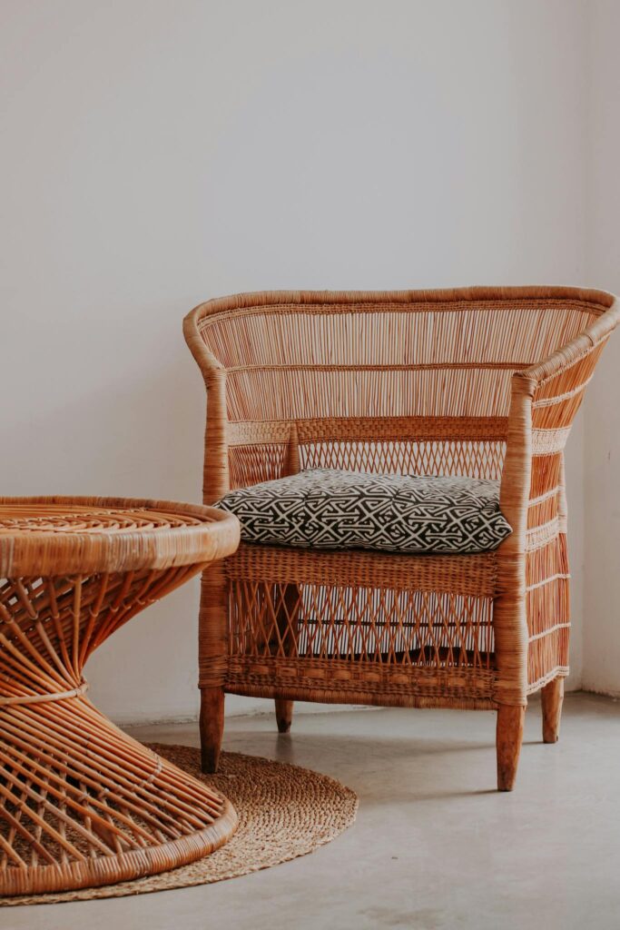 Handwoven wicker armchair and table in cozy indoor space, perfect for home decor.
