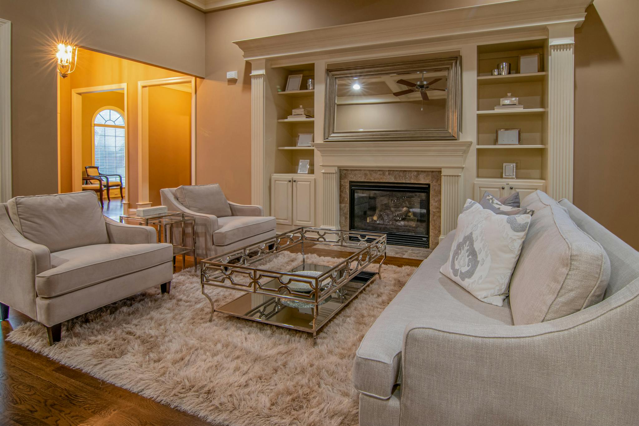 Luxurious living room featuring modern furniture and a cozy fireplace for a warm ambiance.